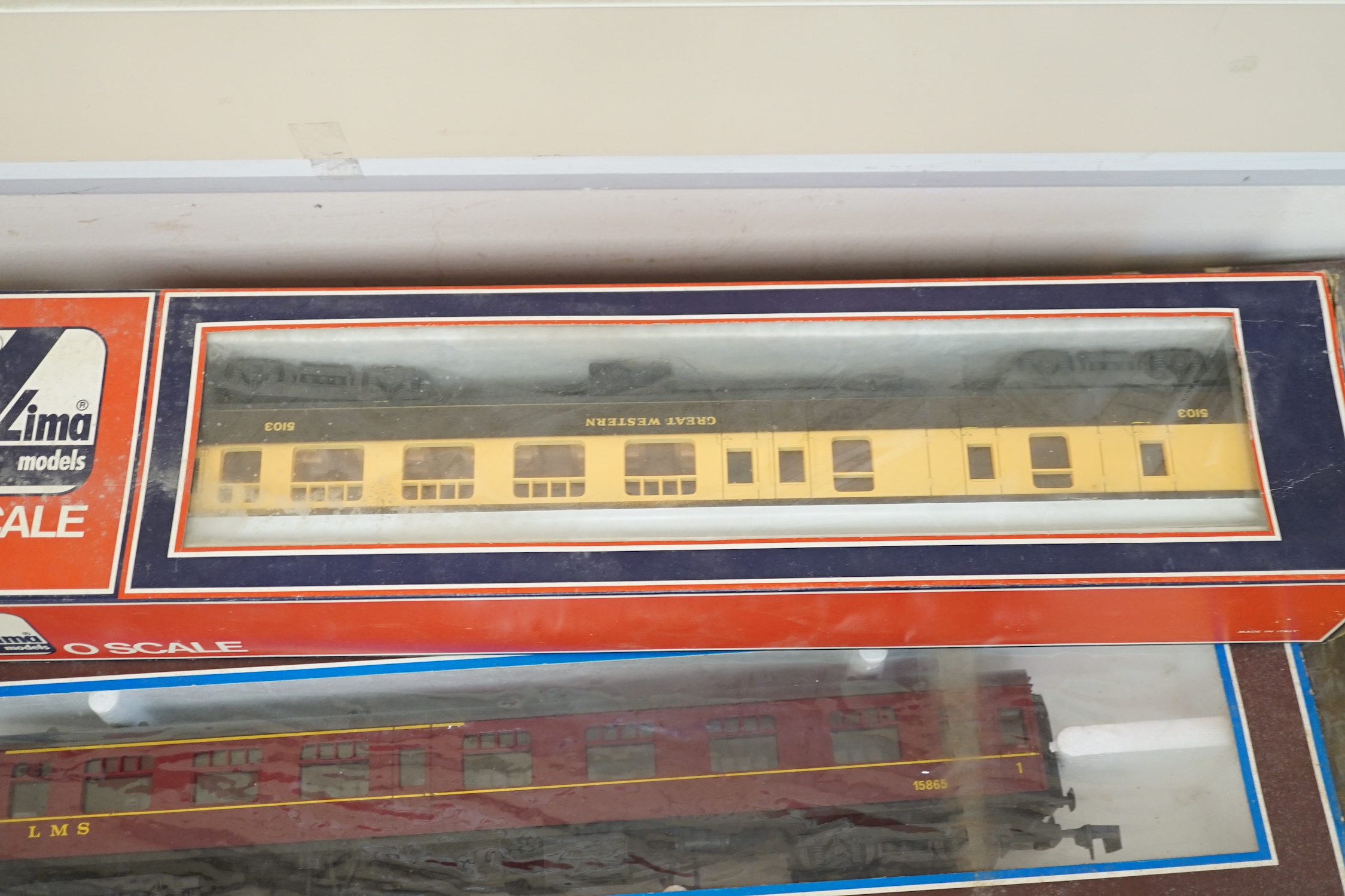 A Lima 0 gauge battery operated train set, together with two additional boxed coaches and a boxed container wagon